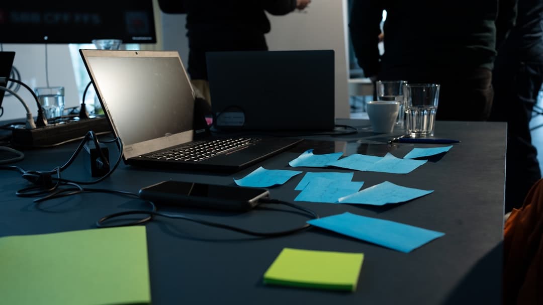 Workspace table with notes and source material for support knowledge review.